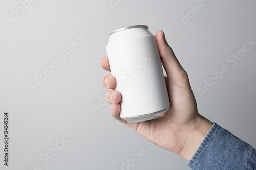 Blank Can in hand on white background, ready to replace your design