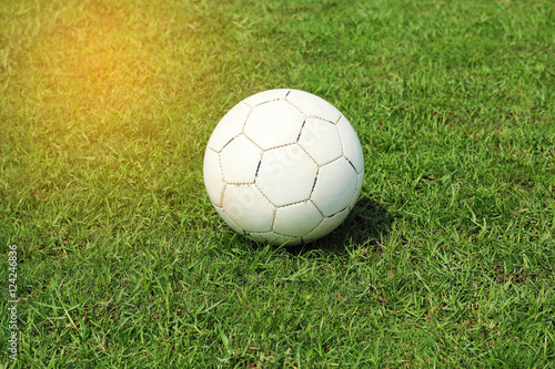 old white soccer football on grass field