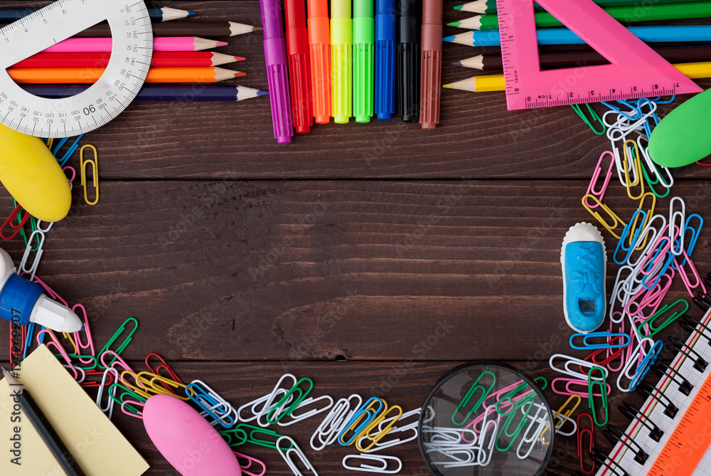 Fototapeta premium School supplies on a wooden table