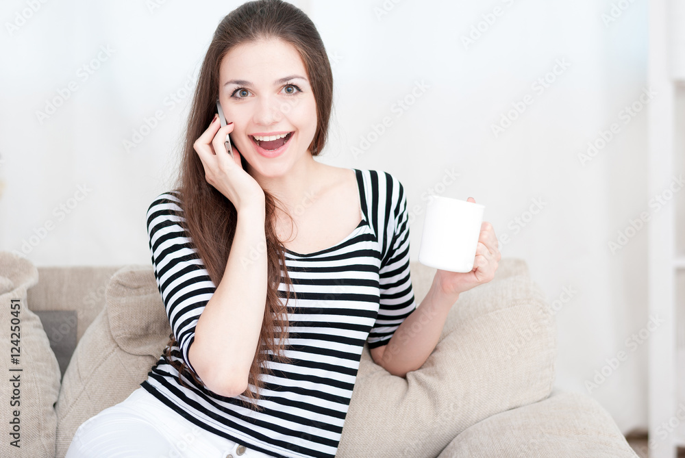 Happy girl on the couch at home Happy girl on the couch at home