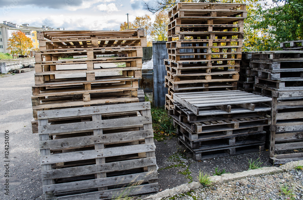 Wooden pallets / wooden pallet overlap in warehouse / stacked wooden pallets / Stacked wooden pallets at a pallet storage / Wooden pallets / wooden pallet overlap in warehouse / stacked wooden pallets / Stacked wooden pallets at a pallet storage /