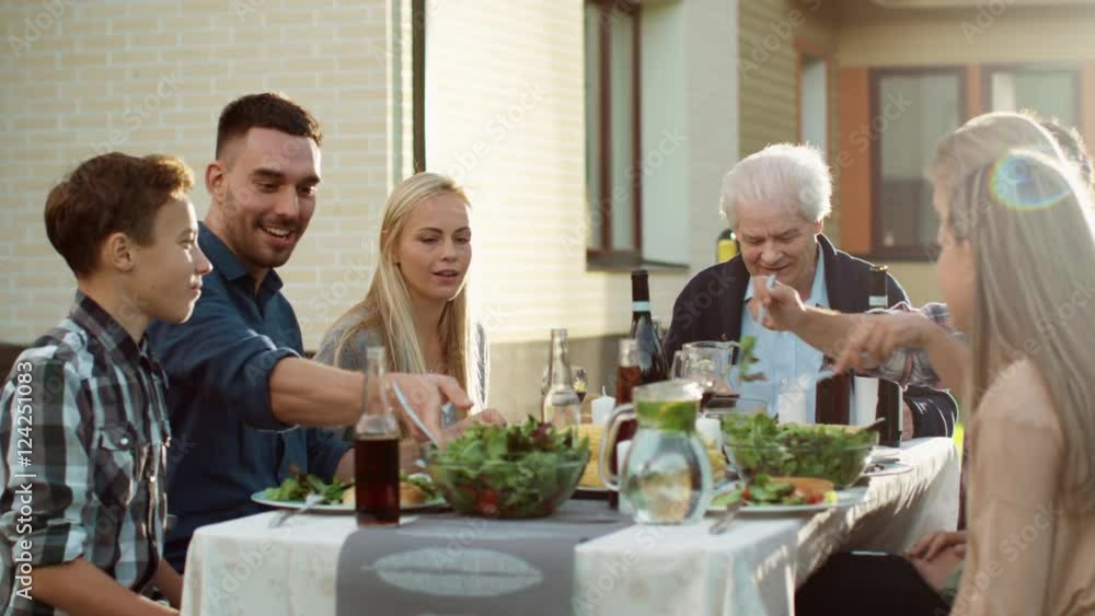 Group of Mixed Race People Having fun, Communicating and Eating at Outdoor Family Dinner Group of Mixed Race People Having fun, Communicating and Eating at Outdoor Family Dinner