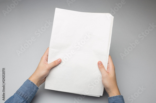 Blank Newspaper in hand Mock-up