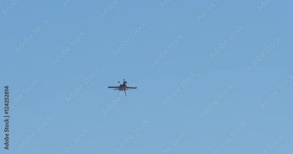 Wide shot of fighter jet in the blue sky Wide shot of fighter jet in the blue sky