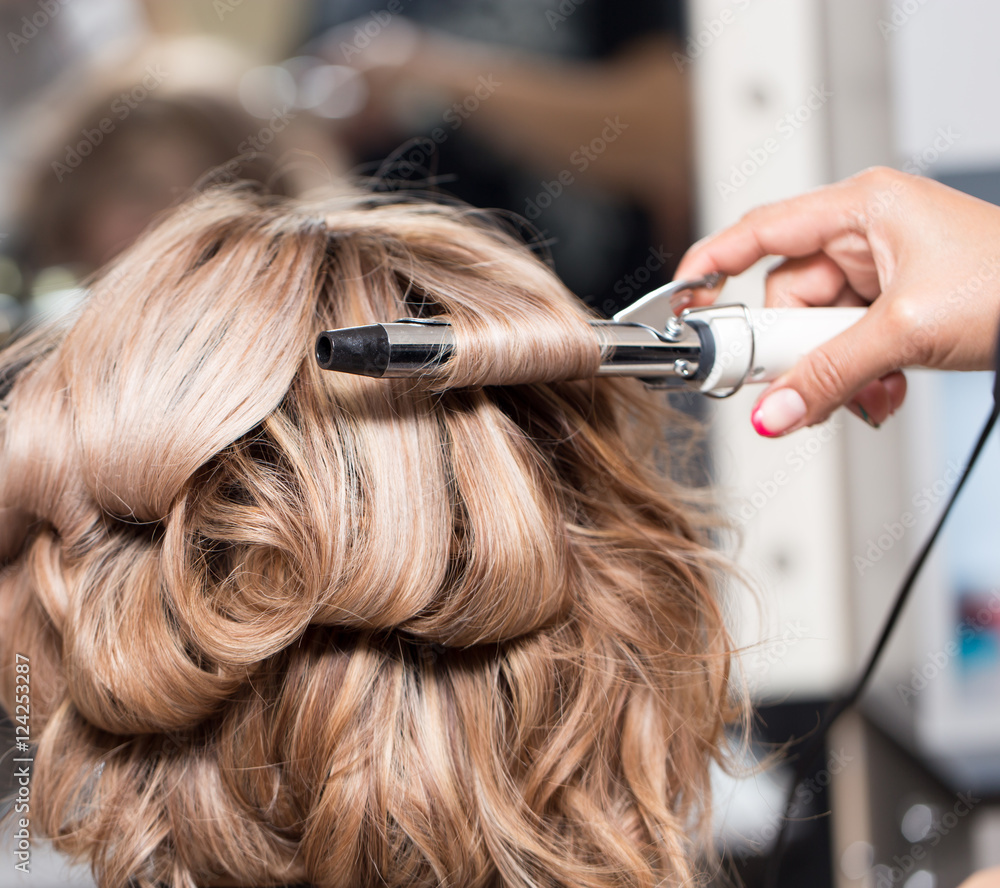 Naklejka premium Female Hairstyles on curling in a beauty salon