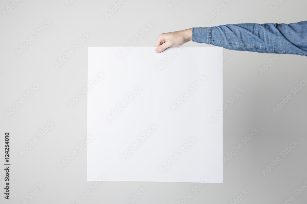 Man holding a white poster Man holding a white poster