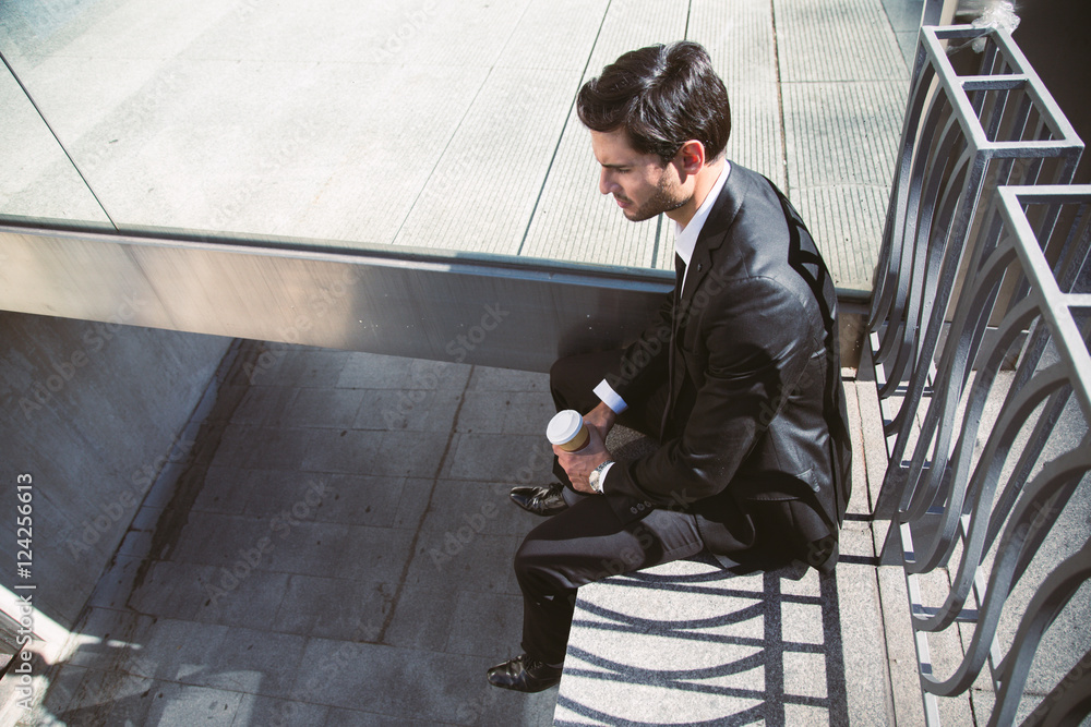 Confident businessman with coffee Confident businessman with coffee