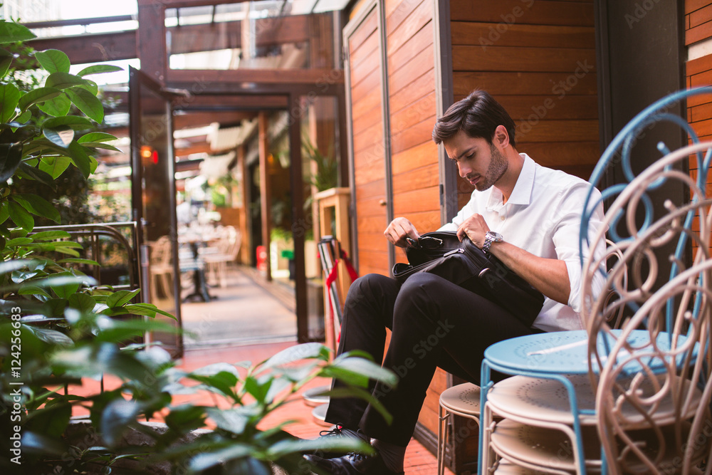 Young handsome guy with briefcase outdoors Young handsome guy with briefcase outdoors