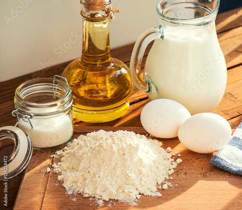 Milk egg flour oil sugar dessert ingredients pancakes baking