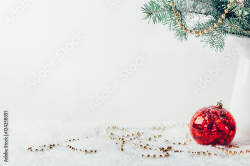 Composition with Christmas decorations in vase on white background
