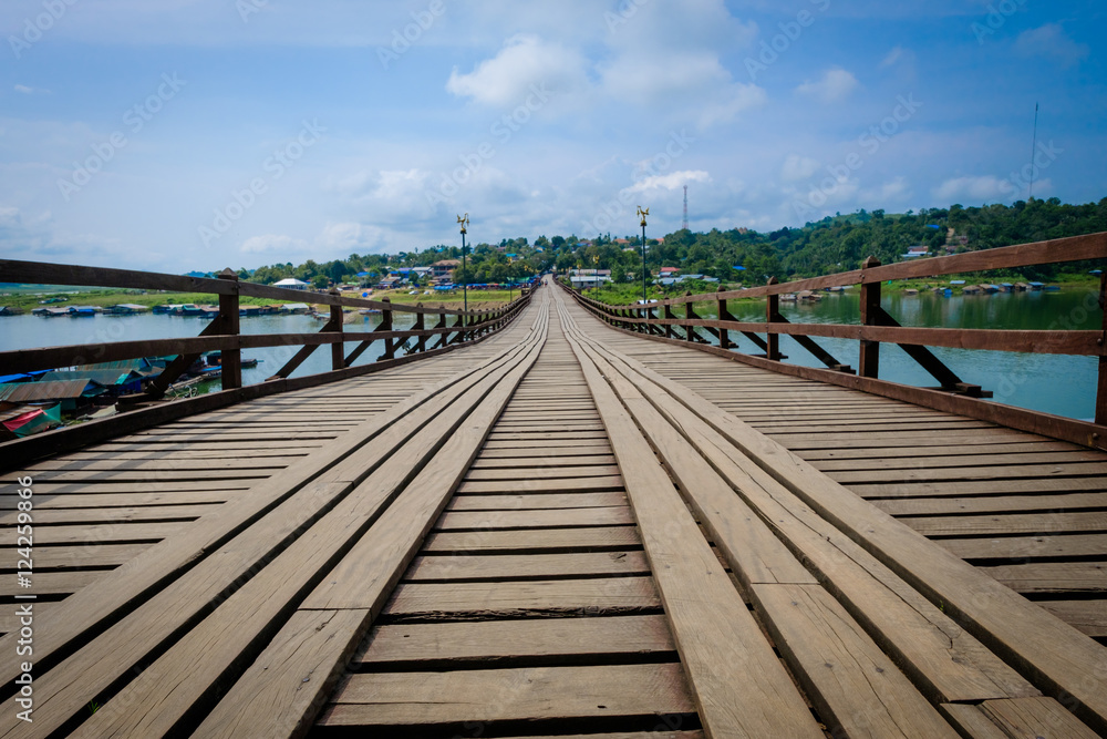 Wooden bridge that crosses the khao laem artificial lake, connecting the mon refugees village to sangkhlaburi village. made by hand. Sangkhaburi,Kanchaburi,Thailand.Photo taken on: October 14, 2016