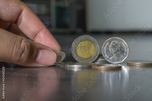 Human pick Thai coin with low key