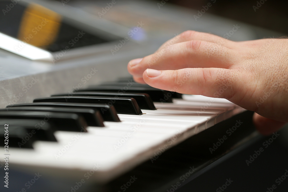 hands of musician playing keyboard in concert hands of musician playing keyboard in concert