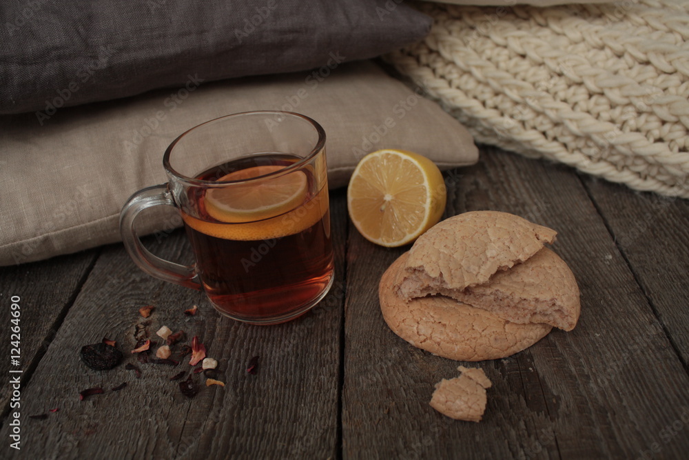 comfort and tea with lemon and biscuits. winter and autumn are pleasantly warm tea. comfort and tea with lemon and biscuits. winter and autumn are pleasantly warm tea.