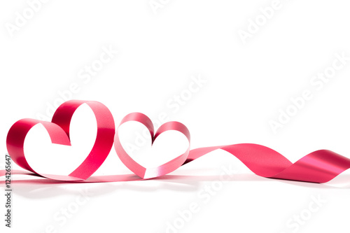 Ribbons shaped as hearts on white