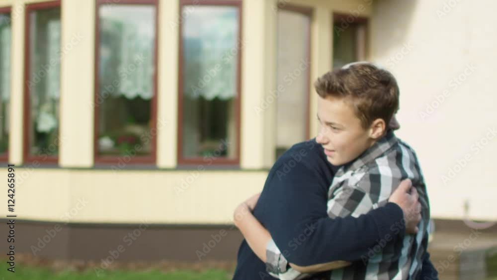 Grandson Runs Toward his Grandfather and Huggs Him Grandson Runs Toward his Grandfather and Huggs Him