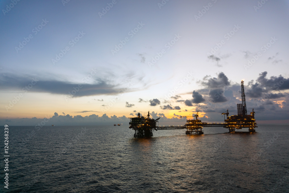 Silhouette of oil rig or platform at oilfield in Malaysia Silhouette of oil rig or platform at oilfield in Malaysia