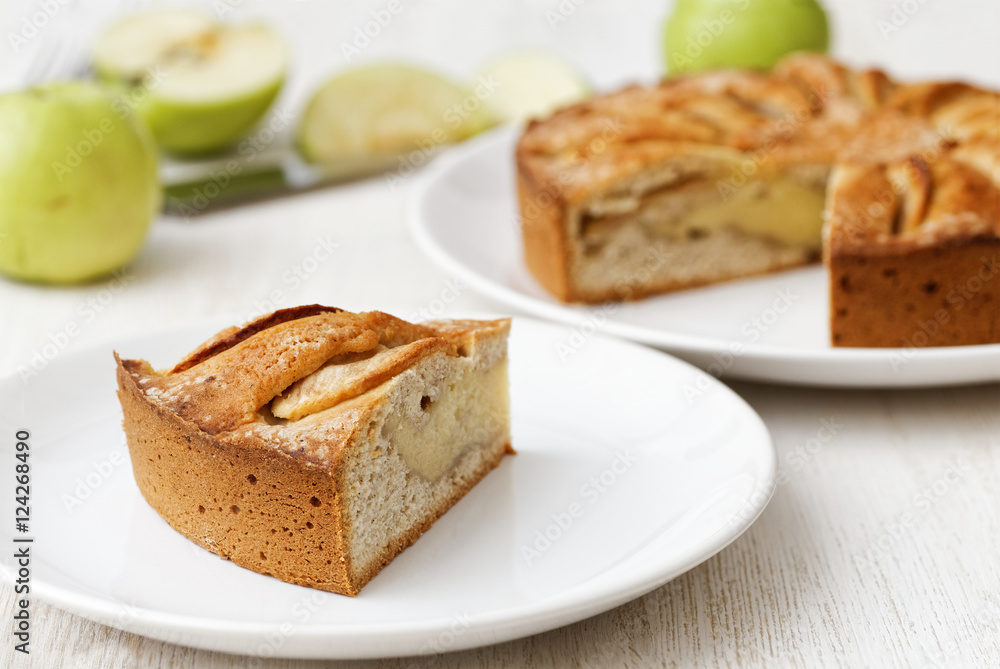 Piece of homemade apple pie on white table