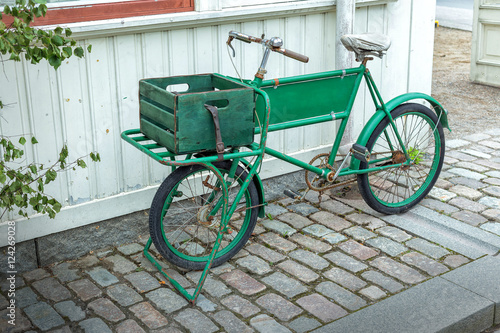 Old bicycle in front of a house