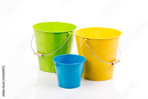 Set of big,little empty iron/metal buckets/ pails/ containers with handle isolated on white background.Colorful kid,child toys .Home gardening equipment. Household accesories.