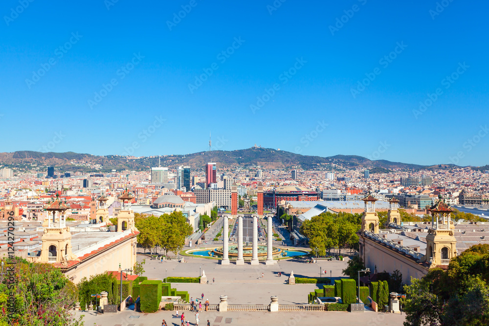 Square of Spain in Barcelona with two Venetian towers in red brick and columns in the foreground, Plaza de Espana. Spain.
