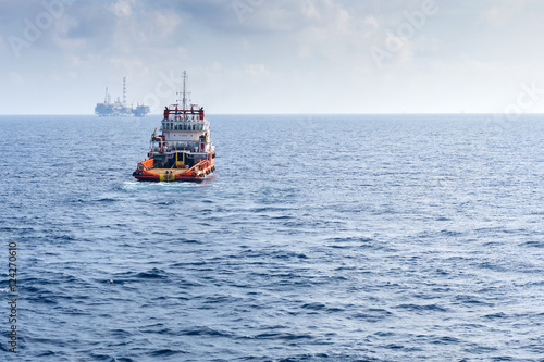 tugboat towing construction barge