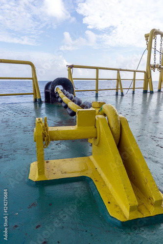Anchor chain secured to stopper or pad-eye on construction barge