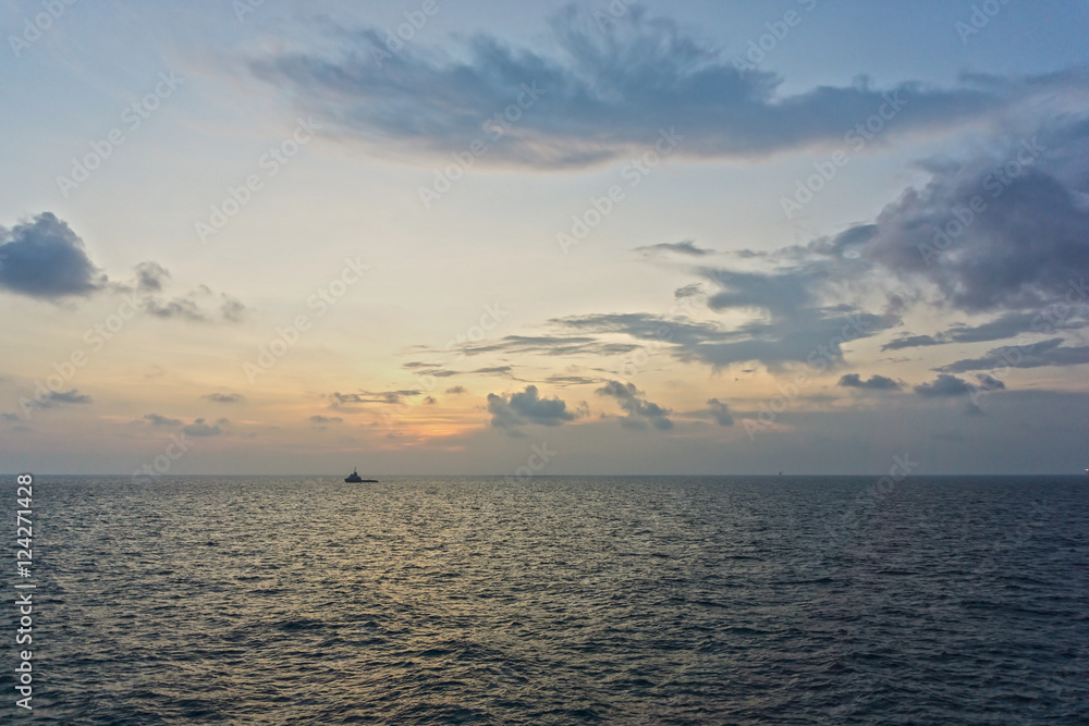 sunset view of a tugboat at oilfield in East Coast of Malaysia. sunset view of a tugboat at oilfield in East Coast of Malaysia.