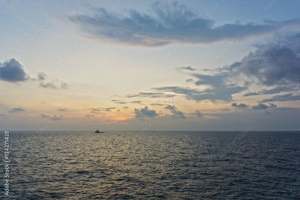 sunset view  of a tugboat at oilfield in East Coast of Malaysia.