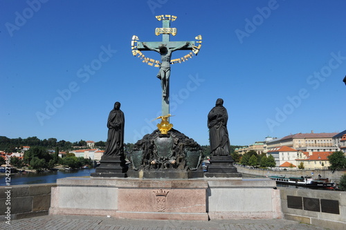 Statue of the Crucifix and Calvary at Charles Bridge in Prague