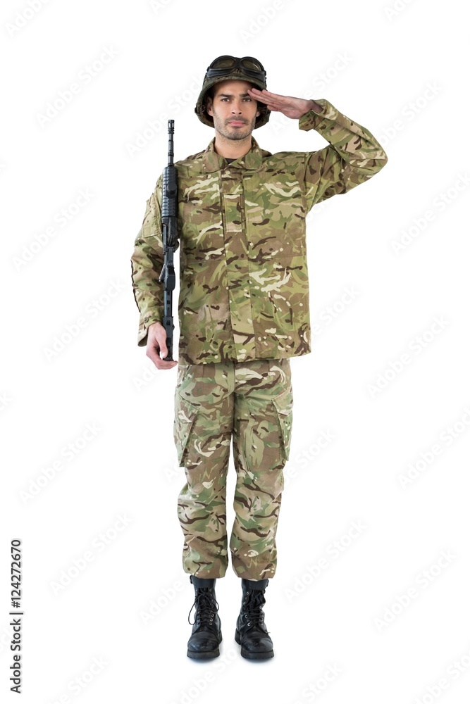 Portrait of soldier holding a rifle and saluting Portrait of soldier holding a rifle and saluting