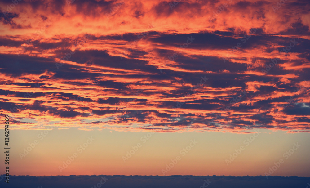 Clouds in the sky at sunset in vintage colors. Beautiful background for your design