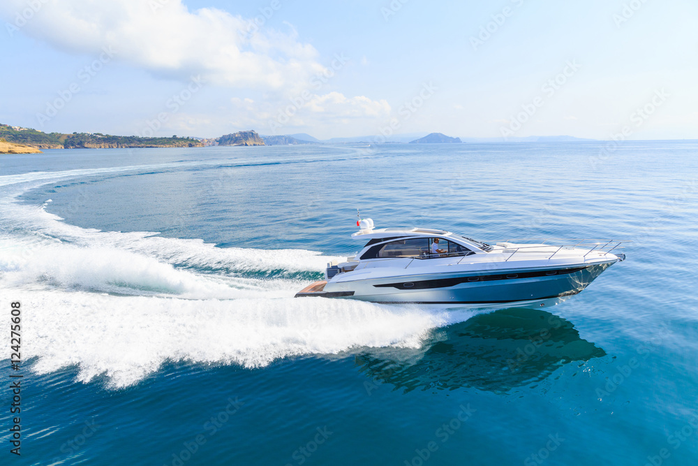 Fototapeta premium luxury motor boat, rio yachts italian shipyard, aerial view