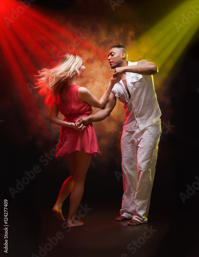 Young couple dances Caribbean Salsa