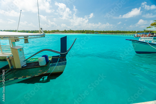 Traditional boats and the pier beside island  Maldives