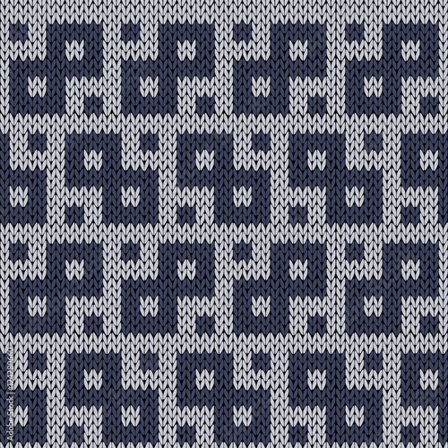 Knitting geometrical seamless pattern in muted blue hues