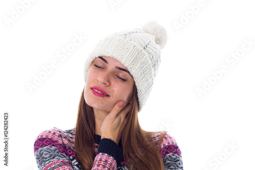 Woman in sweater and white hat