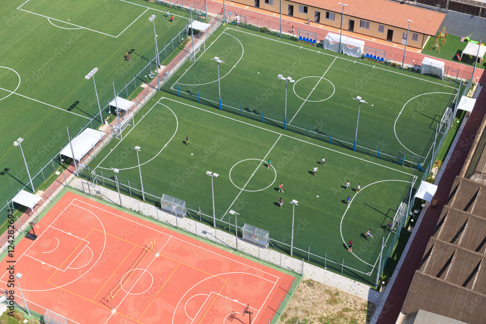 Fototapeta premium Urban soccer pitch, soccer school Child