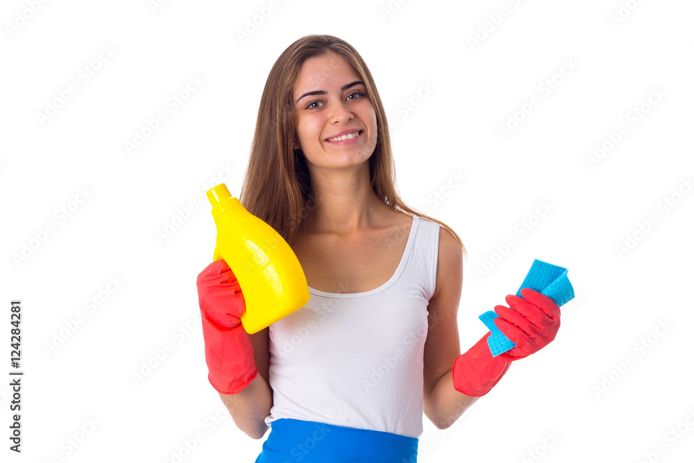 Woman holding duster and detergent Woman holding duster and detergent