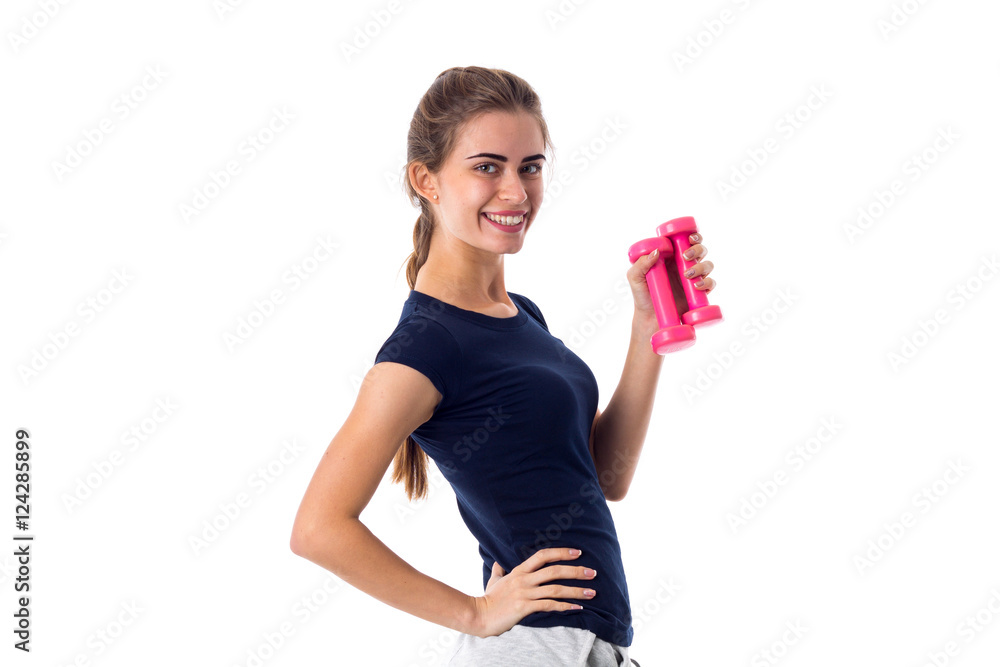 Woman holding two pink dumbbells