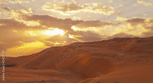 Sunset Over The Sand Dunes; Liwa Oasis, Abu Dhabi, United Arab Emirates photo