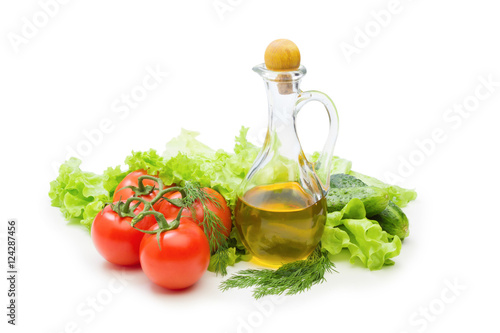 Set vegetable and jug of vegetable oil isolated on the white bac