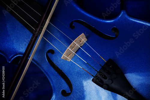 Detail of a violin with blue glitter varnish, music instrument background