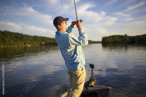 Wallpaper Mural Man with a fish on his line; Ontario, Canada Torontodigital.ca