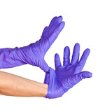 Nurse putting on medical glove isolated on white.