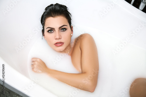  girl  takes a milk bath