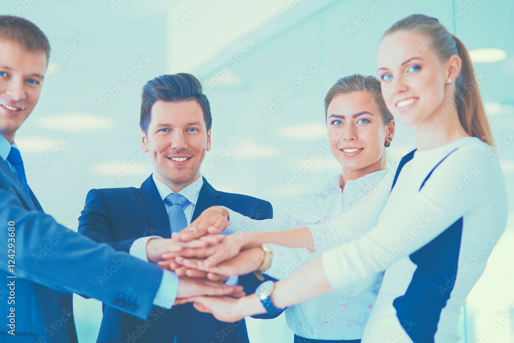 Business people with their hands together in a circle Business people with their hands together in a circle