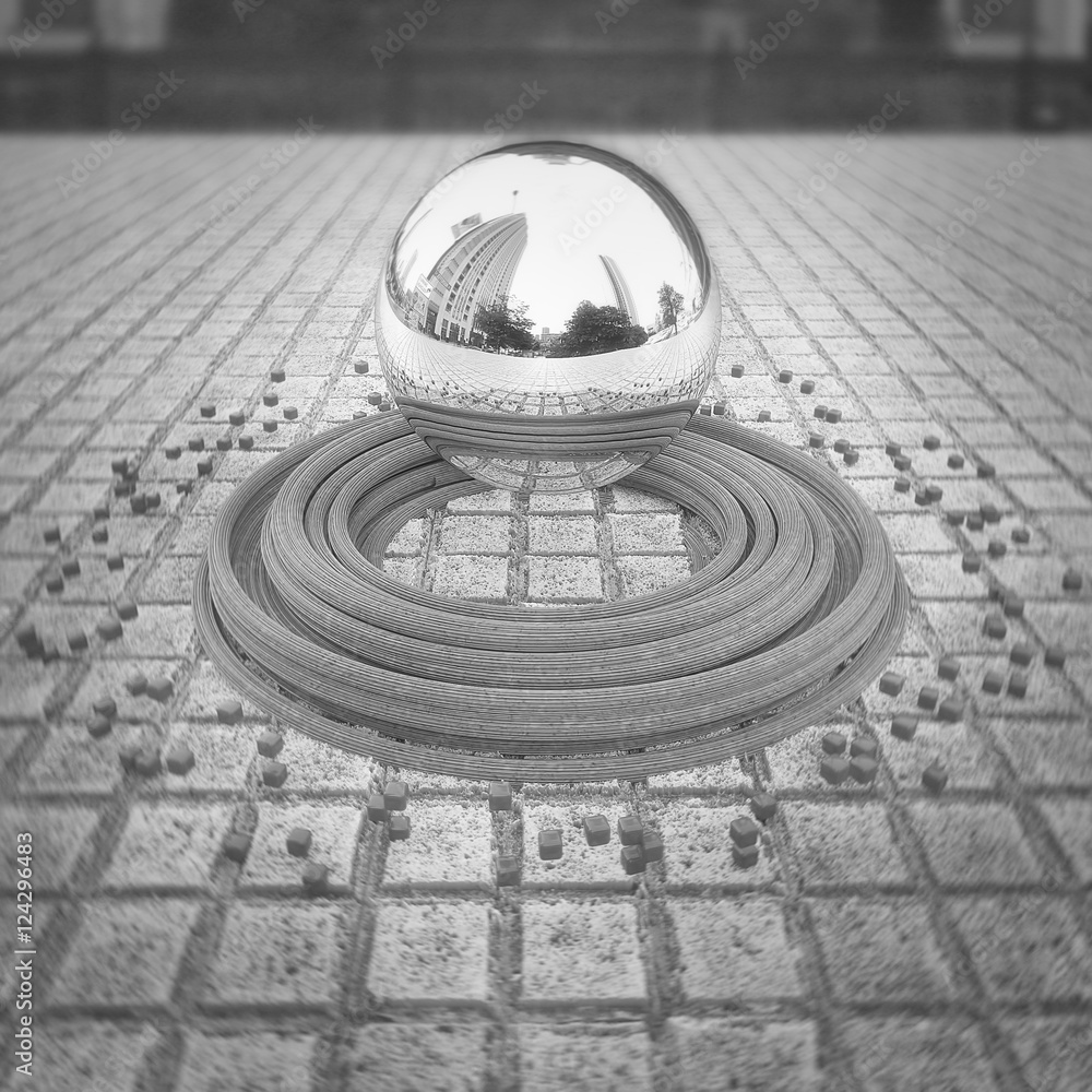 Chrome levitating sphere with reflections located in the center of the