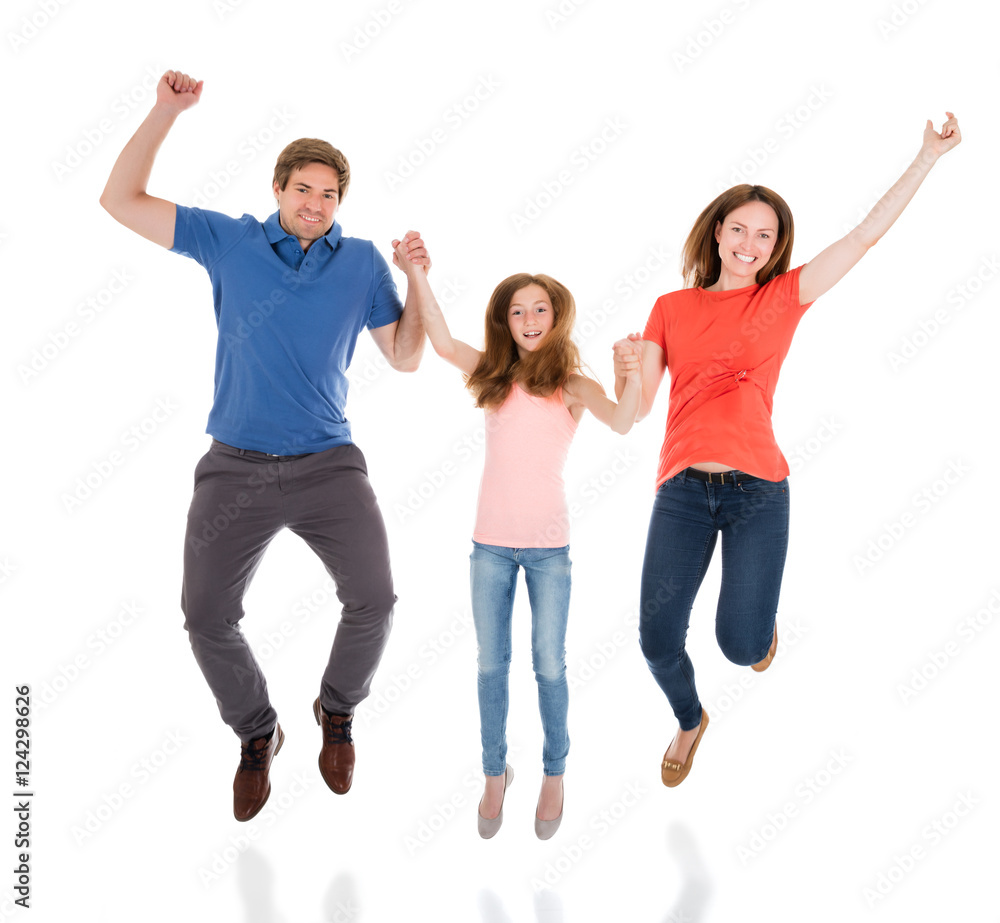Obraz premium Happy Family Jumping Together