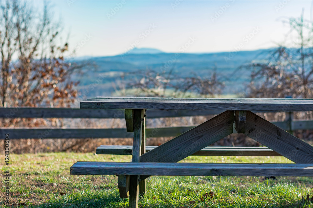 Picnic table in mountain setting.